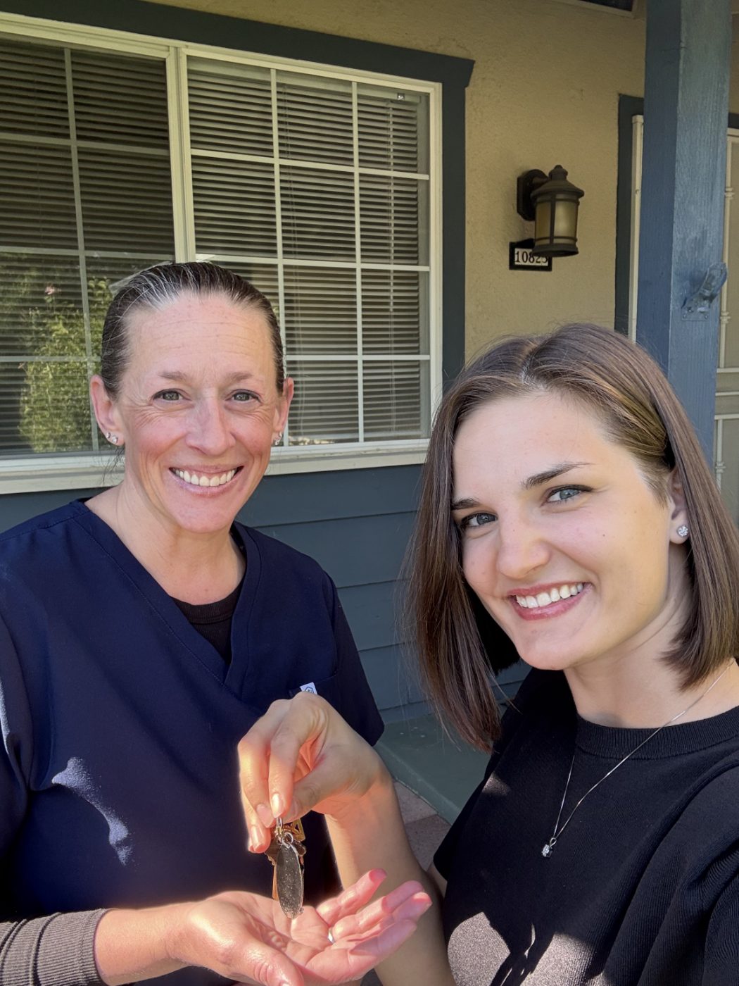 Client receiving the keys to her new home