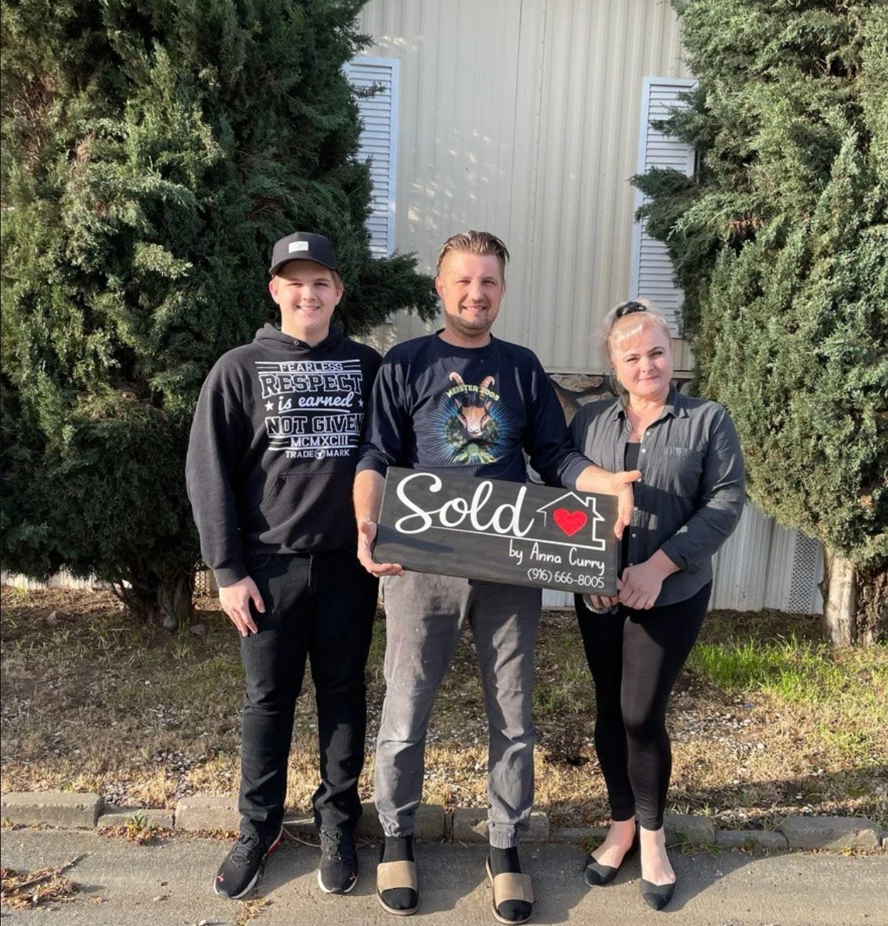 Oleksiy and Yulia with their family at their new home